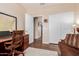 Office features a wood desk, view to the hallway, and a storage closet at 28834 N Spur Dr, San Tan Valley, AZ 85143