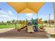 A colorful playground with slides, climbing structures, and a shaded area for children to enjoy at 28834 N Spur Dr, San Tan Valley, AZ 85143