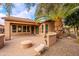 Backyard featuring a built-in BBQ area, fire pit, and palm tree at 28837 N 127Th Ave, Peoria, AZ 85383