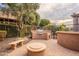 Backyard featuring a built-in BBQ area, fire pit, and seating at 28837 N 127Th Ave, Peoria, AZ 85383