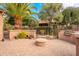 Backyard featuring a built-in BBQ area, fire pit, and seating at 28837 N 127Th Ave, Peoria, AZ 85383