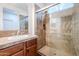 Bathroom showcasing tile-surround shower and vanity, illuminated by natural light at 28837 N 127Th Ave, Peoria, AZ 85383