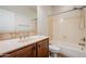 Bathroom featuring a single sink vanity and a combined shower and tub at 28837 N 127Th Ave, Peoria, AZ 85383