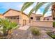 Charming single-story home featuring desert landscaping, a two-car garage, and a private gated entrance at 28837 N 127Th Ave, Peoria, AZ 85383