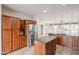 Large kitchen with stainless steel appliances, granite countertops, and an island with bar seating at 28837 N 127Th Ave, Peoria, AZ 85383