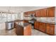 Kitchen featuring stainless appliances, granite countertops, an island, and a breakfast bar at 28837 N 127Th Ave, Peoria, AZ 85383