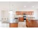 Well-lit kitchen featuring granite countertops, stainless appliances, and ample cabinet space at 28837 N 127Th Ave, Peoria, AZ 85383