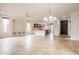 Open floor plan with tile flooring, recessed lighting, and an open kitchen and dining area at 28837 N 127Th Ave, Peoria, AZ 85383