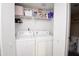 Convenient laundry closet with a stacked washer and dryer unit, maximizing space and adding functionality at 2941 N Oregon St # 12, Chandler, AZ 85225