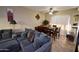 Inviting living room featuring a large sofa and dining area at 2941 N Oregon St # 12, Chandler, AZ 85225