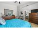 Spacious bedroom with a large dresser and big mirror, and a view into the bathroom at 3175 E Merrill Ave, Gilbert, AZ 85234