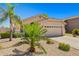 Charming single-story home featuring desert landscaping, a two-car garage and neutral color palette at 3175 E Merrill Ave, Gilbert, AZ 85234