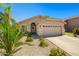 Inviting home with a well-kept front yard, a two-car garage, and a welcoming entrance, offering comfort and style at 3175 E Merrill Ave, Gilbert, AZ 85234