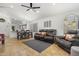 Inviting living space features tile floors, comfortable seating, and an open layout to the dining area and kitchen at 3175 E Merrill Ave, Gilbert, AZ 85234