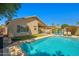 Beautiful pool featuring a backyard with lounge chairs and a covered patio for outdoor relaxation and entertainment at 3175 E Merrill Ave, Gilbert, AZ 85234