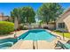 Inviting backyard pool with a spa, lounge chairs, mature trees, and privacy, perfect for relaxation and entertaining at 3175 E Merrill Ave, Gilbert, AZ 85234