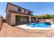 A luxurious backyard boasts a sparkling pool and patio, perfect for outdoor relaxation and entertainment at 3796 E Rakestraw Ln, Gilbert, AZ 85298