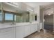 This bathroom has a dual sink vanity with plenty of storage space and natural light at 3796 E Rakestraw Ln, Gilbert, AZ 85298