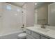 This bathroom has a tub and shower combination and a vanity with sink at 3796 E Rakestraw Ln, Gilbert, AZ 85298