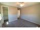 Neutral bedroom featuring plush carpet, ceiling fan, walk-in closet, and ample natural light at 3796 E Rakestraw Ln, Gilbert, AZ 85298