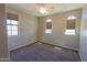 Carpeted bedroom with three windows featuring blinds offering plenty of natural light at 3796 E Rakestraw Ln, Gilbert, AZ 85298