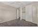 This bedroom has carpet, a ceiling fan, and a closet at 3796 E Rakestraw Ln, Gilbert, AZ 85298