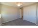 Bedroom with neutral walls, plush carpet, and a closet with double doors at 3796 E Rakestraw Ln, Gilbert, AZ 85298