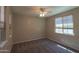 Bedroom with carpet floors, neutral paint, and lots of natural light coming from a window at 3796 E Rakestraw Ln, Gilbert, AZ 85298