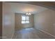 Dining room with tile floors, neutral paint, modern chandelier, and lots of natural light at 3796 E Rakestraw Ln, Gilbert, AZ 85298