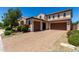 Beautiful home with a spacious three-car garage, brick driveway and drought-tolerant landscaping at 3796 E Rakestraw Ln, Gilbert, AZ 85298