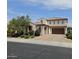 Charming two-story home featuring a tile roof and a well-manicured front yard with beautiful shrubbery at 3796 E Rakestraw Ln, Gilbert, AZ 85298