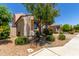 Inviting front yard featuring desert landscaping and mature trees that provide shade at 3796 E Rakestraw Ln, Gilbert, AZ 85298