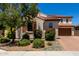 Charming home with a well-maintained front yard, mature trees and flowering shrubs at 3796 E Rakestraw Ln, Gilbert, AZ 85298