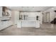 A modern, eat-in kitchen boasting a center island, stainless appliances, and stylish tile floors at 3796 E Rakestraw Ln, Gilbert, AZ 85298
