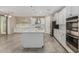 Eat-in kitchen offers stainless steel appliances, a center island, and plentiful countertop space at 3796 E Rakestraw Ln, Gilbert, AZ 85298
