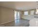 Bright kitchen area with access to patio, white cabinetry, stainless appliances, and tile flooring at 3796 E Rakestraw Ln, Gilbert, AZ 85298