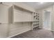 This walk-in closet features custom shelving, and rods for storage at 3796 E Rakestraw Ln, Gilbert, AZ 85298