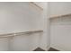 This walk-in closet features custom shelving, and rods for storage at 3796 E Rakestraw Ln, Gilbert, AZ 85298