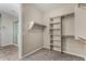 This walk-in closet features custom shelving, and rods for storage at 3796 E Rakestraw Ln, Gilbert, AZ 85298