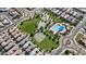 Aerial view of a park in a community featuring a basketball court, a pool, and a tennis court at 3881 E Galveston St, Gilbert, AZ 85295