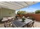 Charming backyard with a covered patio, seating and barbecue, perfect for entertaining outdoors at 3881 E Galveston St, Gilbert, AZ 85295