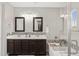 Modern bathroom with dual sinks, mosaic tile backsplash, and a separate shower and soaking tub at 3881 E Galveston St, Gilbert, AZ 85295
