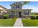 Charming two-story home with a well-maintained lawn and a welcoming front porch at 3881 E Galveston St, Gilbert, AZ 85295