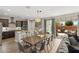 Open-concept kitchen and dining area with sliding doors to an outdoor patio at 3881 E Galveston St, Gilbert, AZ 85295
