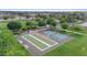 Community park with tennis and bocce ball courts offers recreational opportunities amid green spaces and mature trees at 3881 E Galveston St, Gilbert, AZ 85295