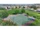 Community park with a basketball court is surrounded by lush greenery and mature trees, offering recreational space at 3881 E Galveston St, Gilbert, AZ 85295