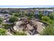 Aerial view of a neighborhood playground with modern equipment, shaded areas, and secure surfacing for enjoyment at 3881 E Galveston St, Gilbert, AZ 85295