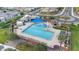 Aerial view of a community pool with ample seating, shade, and Gathering-friendly amenities surrounded by lush landscaping at 3881 E Galveston St, Gilbert, AZ 85295