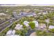 Aerial view showcasing the home's location with nearby retail and stunning mountain views at 39017 N Habitat Cir, Cave Creek, AZ 85331