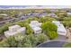 Aerial view showcasing the home's location, surrounded by lush greenery and a vibrant community at 39017 N Habitat Cir, Cave Creek, AZ 85331